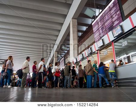 Moscow, Russia - June 15, 2016: People stand in line for tickets at the ticket counter Kursky railway station Moscow