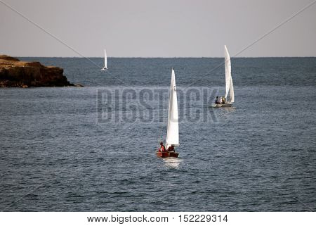 sailing boat out to sea near the shore