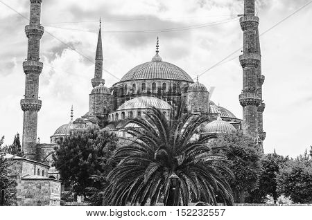 Sultan Ahmed Blue Mosque in Istanbul Turkey - one of the most popular landmarks in the city. Close view during the day with cloudy sky. Black and white