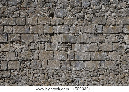 the stone wall, visible stones and the individual elements