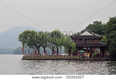 People Are Walking In Park Of The West Lake
