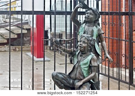 RUSSIA ZELENOGRADSK - OCTOBER 11 2014: Sculpture of a children in the Zelenogradsk promenade. Zelenogradsk (Cranz) is a resort town in Kaliningrad Oblast Russia near the Curonian Spit on the Baltic Sea.