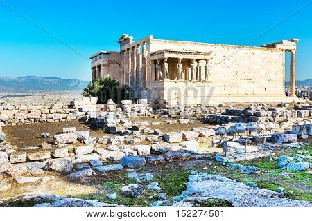 Erechtheum temple ruins decorated with Caryatids female statues in Acropolis