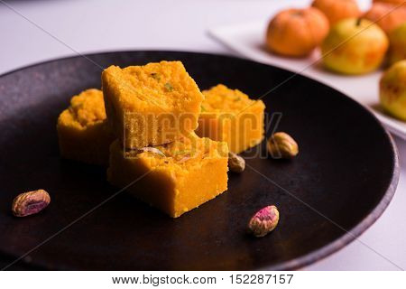 almond, pista, mango and orange flavoured pedha and burfi Indian sweet dish made from milk , dry fruits and fruits, diwali food