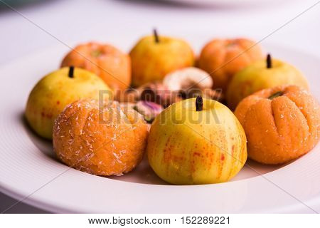 almond, pista, mango and orange flavoured pedha and burfi Indian sweet dish made from milk , dry fruits and fruits, diwali food