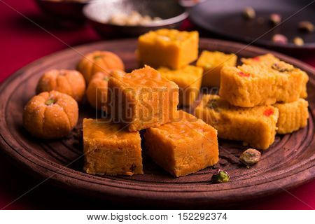 almond, pista, mango and orange flavoured pedha and burfi Indian sweet dish made from milk , dry fruits and fruits, diwali food