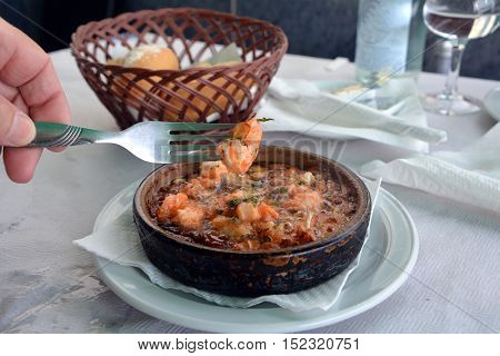 Sizzling prawns with garlic. Traditional Spanish tapas dish.