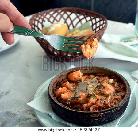 Sizzling prawns with garlic. Traditional Spanish tapas dish.