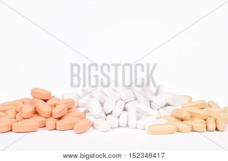 Pills on a white background Healthcare and Medicin