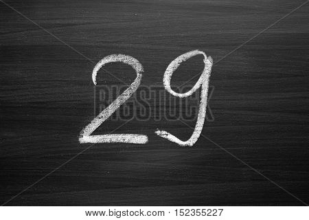 number twenty nine enumeration written with a chalk on the blackboard