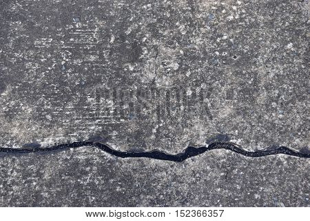 Cracking cement on the ground, may be dangerous.