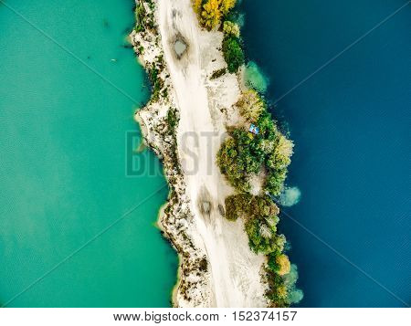Aerial view - narrow strip of sandy shore and green and blue water
