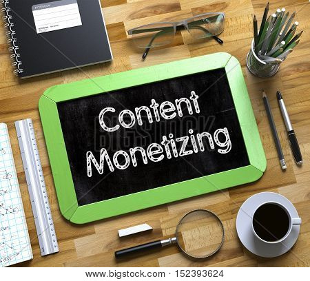 Content Monetizing Handwritten on Green Chalkboard. Top View Composition with Small Chalkboard on Working Table with Office Supplies Around. Content Monetizing on Small Chalkboard. 3d Rendering.