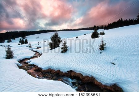 mountain river during winter sunset in Germany