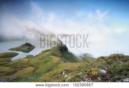 alpine lake in dense fog Bavaria Germany