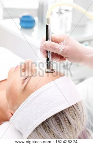 Relaxed woman during a microdermabrasion treatment in beauty salon