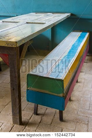 Old wooden bench and table at the cafe.