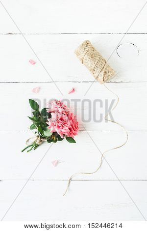 Workspace. Rose flowers. Flat lay top view