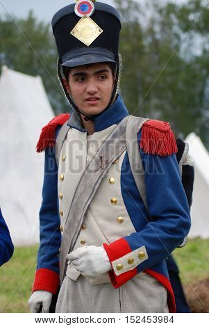 BORODINO MOSCOW REGION - SEPTEMBER 04 2016: Reenactor dressed as Napoleonic war soldier at Borodino battle historical reenactment in Russia. Color photo.