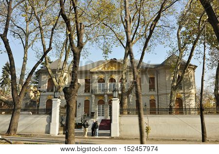 BUCHAREST ROMANIA - NOV 28 2008: View from the most famous avenue in Bucharest Calea Victorie to the luxury building with pure gold details on a warm autumn day
