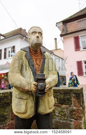 LAHR GERMANY - NOV 30 2013: Urban wooden photographer statue in the center of Lahr Germany during Christmas holidays