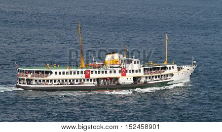 ISTANBUL TURKEY - JULY 30 2016: Sehir Hatlari ferry carry passengers between Asian and European sides of Istanbul. Sehir Hatlari was established in 1844 and now carry 150000 passengers a day.