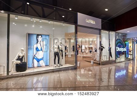 BARCELONA, SPAIN - CIRCA NOVEMBER, 2015: La Perla store at Barcelona Airport. Barcelona-El Prat Airport is an international airport. It is the main airport of Catalonia, Spain.