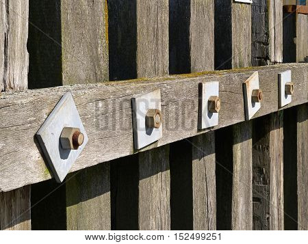 Wooden dock breakwall in a marina harbour as safety and protection method