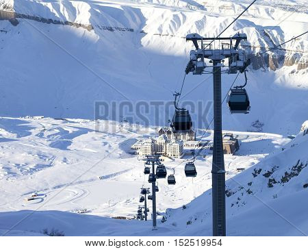 Gondola Lift On Ski Resort At Winter Sun Evening