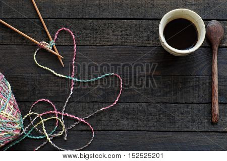 Knitted Background With Needle, Yarn, Coffee Cup