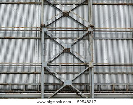 a large fence made of metal frame and sheet.