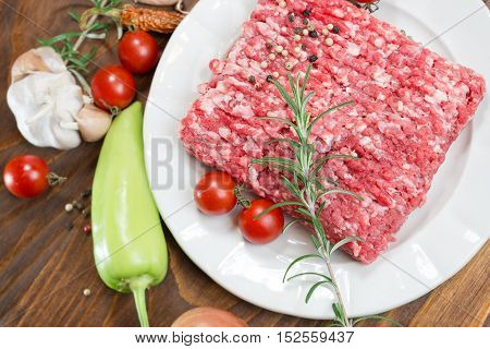Raw fresh ground beef meat - minced meat on plate