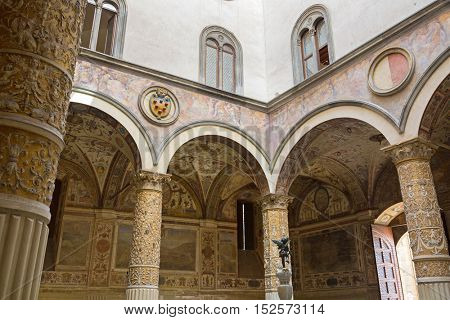 FLORENCE, ITALY - SEPTEMBER 2016 : Interior of Old Palace, Palazzo Vecchio's first Courtyard, town hall of Florence, Italy on September 21, 2016. Frescoes  are cities of Austrian Habsburg monarchy