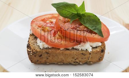 Fresh tomato and feta cheese sandwich. Healthy breakfast horizontal selective focus