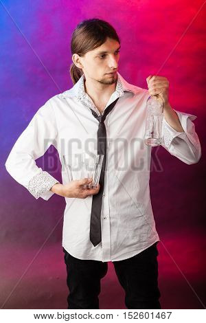 Alcohol liquor party relax flair bartending concept. Barman with bottle and glasses. Youthful tapster on colorful background.