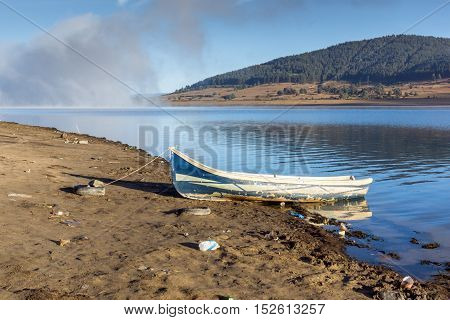 Old boat at the coastline of Batak Reservoir, Pazardzhik Region, Bulgaria