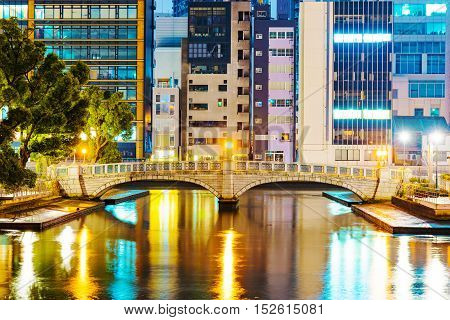 Osaka financial district with bridge at night