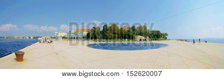 ZADAR CROATIA - SEPTEMBER 14: Panoramic view of the Sea organ and watefront area of Zadar which is a popular landmark for tourists on September 14 2016 in Zadar