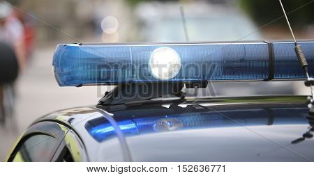 Spot Light And Blue Flashing Lights Of The Police Car