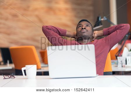 Young African-american Business Man Taking A Break At His Desk