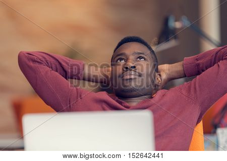 Young African-american Business Man Taking A Break At His Desk