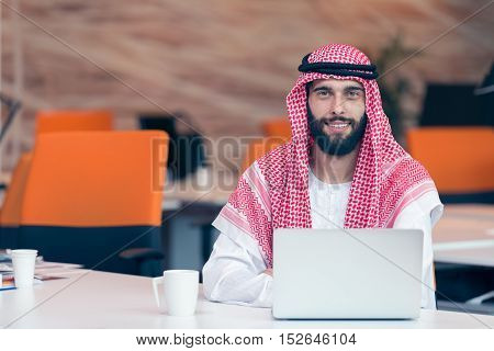 Arabian Businessman Working In Modern Startup Office