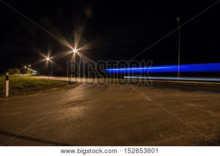 Nigh highway. Cars headlights in motion blur. Long exposure shot.
