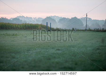 Street Lantern On Rural Road On Misty Morning. Geesteren. Gelderland. The Netherlands.