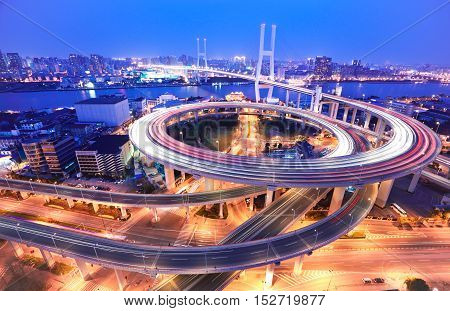 Spiral Bridge In Shanghai Huangpu River On The Bird's Eye View Of The Night