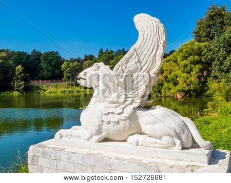 Griffin statue. Griffins is mythological winged beings with a body of a lion and the head of an eagle