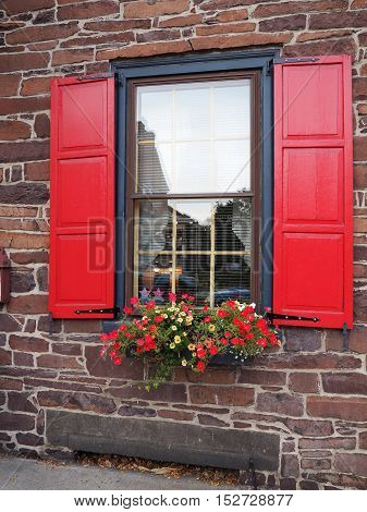 Gettysburg PA - October 14: front window with red shutters for a colonial style house. This old historic home was built in 1786.