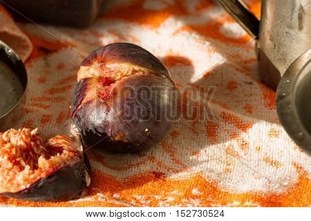 Figs isolated lying on orange towel. Violet fruits of F cus carica