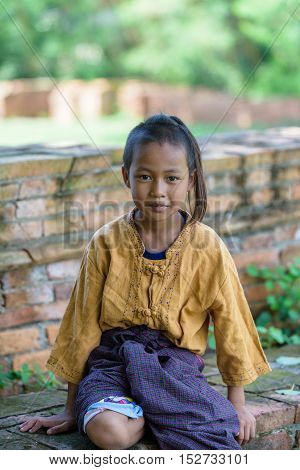 Asian Thai boy with look and smile he dress thai local dress.