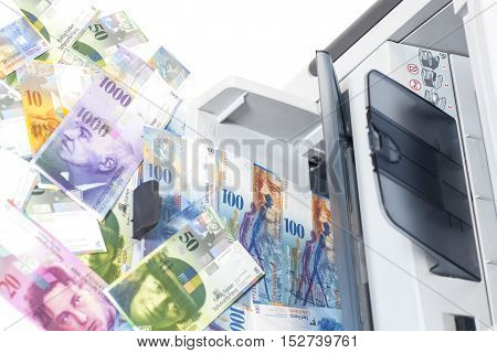 Printer printing  Swiss francs currency of switzerland isolated on white background